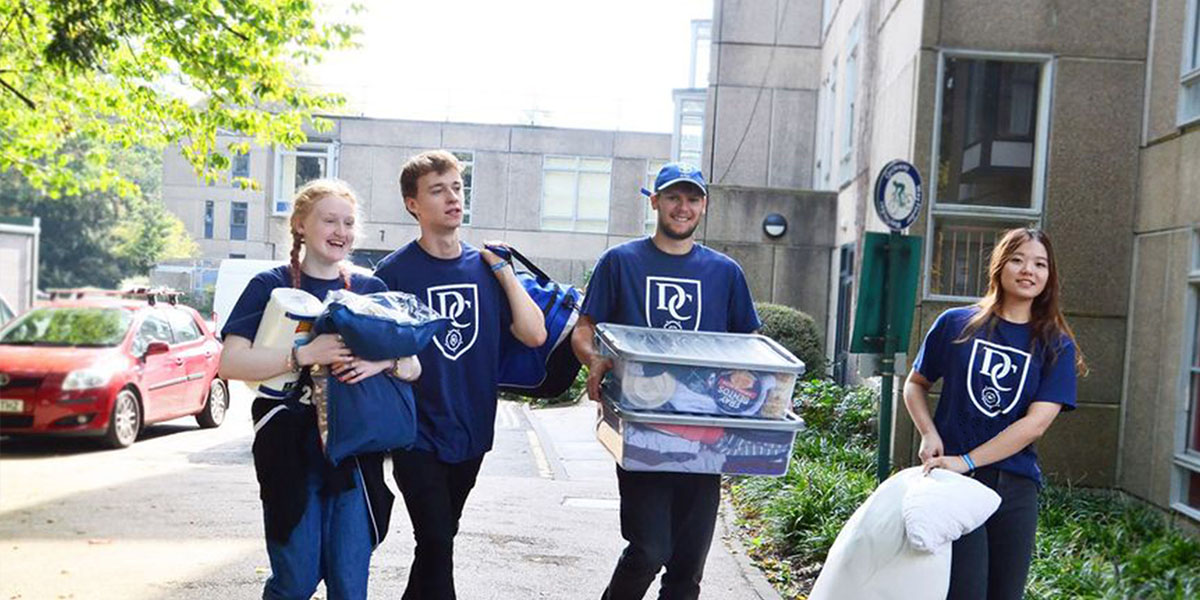 Derwent college stycs carrying boxes